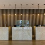 Hotel reception featuring 3 reception desks made from solid surface materials