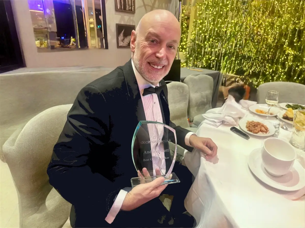 Andrew Scott holding the Guest Speaker of the Year Award at the 2025 Dealmaker Awards in Richmond, London